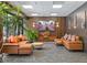 Comfortable lounge area featuring modern decor, sectional sofas, and wood paneling at 620 Peachtree Ne St # 911, Atlanta, GA 30308