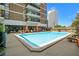 Outdoor swimming pool with lounge chairs and city views at 620 Peachtree Ne St # 911, Atlanta, GA 30308