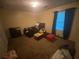 Bedroom featuring dark curtains, carpet, and an open window at 8959 Stonebridge Blvd, Douglasville, GA 30134