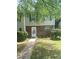 Inviting townhome with brick accents, green shutters, and a well-kept lawn. The house number is clearly visible at 8959 Stonebridge Blvd, Douglasville, GA 30134