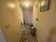 Neutral hallway featuring a decorative rug and access to rooms at 8959 Stonebridge Blvd, Douglasville, GA 30134