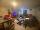 Cozy living room with a large sectional sofa, modern decor, and a flat-screen TV for relaxing evenings at 8959 Stonebridge Blvd, Douglasville, GA 30134