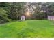 The backyard with ample green space has a shed to store your lawncare and gardening items at 1333 Trailwater Chase Nw, Acworth, GA 30102