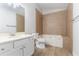 Full bathroom featuring tile surround, single sink vanity, and tub at 1333 Trailwater Chase Nw, Acworth, GA 30102