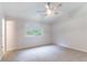 This spacious bedroom has neutral carpet, a ceiling fan and a window that allows lots of natural light at 1333 Trailwater Chase Nw, Acworth, GA 30102