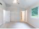 This carpeted bedroom has a ceiling fan and natural light from the window at 1333 Trailwater Chase Nw, Acworth, GA 30102