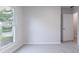 This bedroom has neutral carpet, a window for natural light, and a door to the hall at 1333 Trailwater Chase Nw, Acworth, GA 30102