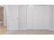 This bedroom boasts neutral carpet, a door to the hall, and closet with bi-fold doors at 1333 Trailwater Chase Nw, Acworth, GA 30102