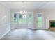 Inviting dining space with natural light, views to the backyard and modern flooring, adjacent to the living room at 1333 Trailwater Chase Nw, Acworth, GA 30102