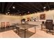 Recreational basement with ping pong table, treadmill, and entertainment area offering fun for all at 1361 Chatley Way, Woodstock, GA 30188