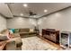 Basement featuring a comfortable seating area with a large sectional couch and a wine cooler at 1361 Chatley Way, Woodstock, GA 30188