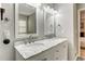 Bathroom featuring double sink vanity with marble countertop and modern fixtures at 1361 Chatley Way, Woodstock, GA 30188