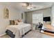 Bedroom featuring ceiling fan, natural light, and a desk area for studying at 1361 Chatley Way, Woodstock, GA 30188