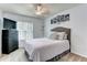 Cozy bedroom with soft lighting, neutral colors, and comfortable furnishings at 1361 Chatley Way, Woodstock, GA 30188