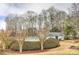 Community pool area surrounded by mature trees and landscaping at 1361 Chatley Way, Woodstock, GA 30188
