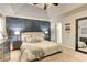 Spacious main bedroom with large bed, side tables, lamps, and decorative wall at 1361 Chatley Way, Woodstock, GA 30188