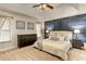 Beautiful main bedroom featuring decorative wall, tray ceiling, and natural light at 1361 Chatley Way, Woodstock, GA 30188