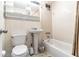 Bathroom featuring tiled walls, vanity sink, and a shower-tub combo at 215 Piedmont Ne Ave # 502, Atlanta, GA 30308