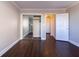 Bedroom featuring hardwood floors, an open closet, and an entry hallway at 215 Piedmont Ne Ave # 502, Atlanta, GA 30308