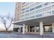 Landmark building with a covered entryway and views of the surrounding landscape at 215 Piedmont Ne Ave # 502, Atlanta, GA 30308