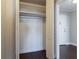 Bright closet with shelving, hanging rod, and dark wood-look floors at 215 Piedmont Ne Ave # 502, Atlanta, GA 30308