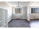 Bright dining room featuring a modern chandelier, hardwood floors, and large window with city views at 215 Piedmont Ne Ave # 502, Atlanta, GA 30308