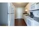 Functional kitchen with white cabinets, laminate countertops, and essential appliances at 215 Piedmont Ne Ave # 502, Atlanta, GA 30308