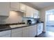 Kitchen with white cabinets, laminate countertops, and appliances at 215 Piedmont Ne Ave # 502, Atlanta, GA 30308