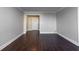Spacious living room featuring wood flooring and neutral wall paint at 215 Piedmont Ne Ave # 502, Atlanta, GA 30308