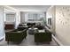 Inviting living room featuring modern decor, a comfortable sectional, and large windows with city views at 215 Piedmont Ne Ave # 502, Atlanta, GA 30308