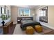Serene bedroom with a plush bed, accent mirror, and city views creates a relaxing retreat at 215 Piedmont Ne Ave # 502, Atlanta, GA 30308