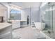 Bright bathroom featuring a soaking tub, glass shower, double vanity and lots of natural light at 2275 Holly Run Dr, Jonesboro, GA 30236