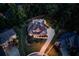 Stunning aerial view of a two-story home featuring a sparkling pool, backyard and lush landscaping at 3217 Aberrone Pl, Buford, GA 30519