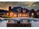 This beautifully landscaped backyard features a large pool, perfect for relaxing and enjoying the outdoors at 3217 Aberrone Pl, Buford, GA 30519