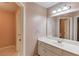 Bathroom featuring a single vanity sink with white cabinets and tile floor at 3217 Aberrone Pl, Buford, GA 30519