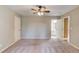 Large bedroom with neutral carpet flooring and ensuite bathroom access at 3217 Aberrone Pl, Buford, GA 30519