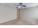Spacious bedroom with carpet, ceiling fan, and white trim throughout at 3217 Aberrone Pl, Buford, GA 30519