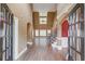 Bright foyer with hardwood floors, high ceilings, and an open view into the expansive living space at 3217 Aberrone Pl, Buford, GA 30519