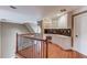 Upstairs landing with built-in shelves and desk; hardwood floors and white trim at 3217 Aberrone Pl, Buford, GA 30519