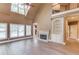 Comfortable living room with fireplace, built in shelving, and lots of natural light at 3217 Aberrone Pl, Buford, GA 30519