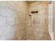 Shower featuring light-colored tile, a showerhead, and a handheld shower wand at 3217 Aberrone Pl, Buford, GA 30519