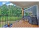 Relaxing deck with wood floors, outdoor seating, grill, and a view of the greenery at 3508 Mount Blue Ave, Tucker, GA 30084