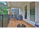 View of a deck with wood floors, outdoor seating, and a grill, offering a space for relaxing at 3508 Mount Blue Ave, Tucker, GA 30084