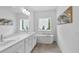 Bathroom featuring double vanity, soaking tub, and a large window allowing for lots of natural light at 3508 Mount Blue Ave, Tucker, GA 30084