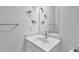 Clean bathroom with a decorative vanity, geometric origami-style wall art and a large mirror at 3508 Mount Blue Ave, Tucker, GA 30084