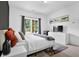 The bedroom features an area rug, large window, and stylish decor with an adjacent dresser at 3508 Mount Blue Ave, Tucker, GA 30084