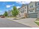 Street view of modern townhomes with attached garages, craftsman style architectural details and manicured lawns at 3508 Mount Blue Ave, Tucker, GA 30084