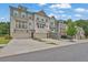 Modern townhome community featuring attached garages, craftsman details, and beautifully landscaped grounds at 3508 Mount Blue Ave, Tucker, GA 30084