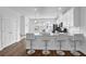 Modern kitchen with white cabinets, granite countertops, stainless appliances, and bar seating at 3508 Mount Blue Ave, Tucker, GA 30084
