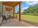 Cozy covered patio with outdoor seating and a view of the lawn and trees at 3508 Mount Blue Ave, Tucker, GA 30084